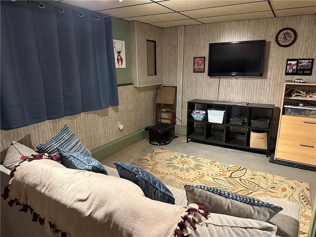 390 Bolivar Dr, Foster-Town, PA 16701 - living room featuring a paneled ceiling, concrete flooring, and baseboards