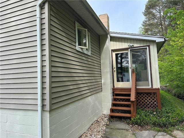 390 Bolivar Dr, Foster-Town, PA 16701 - view of side of home featuring a chimney and entry steps