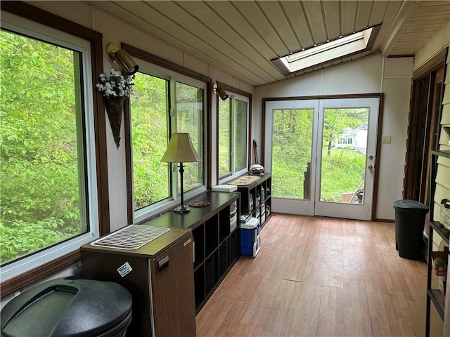 390 Bolivar Dr, Foster-Town, PA 16701 - sunroom / solarium with a skylight, vaulted ceiling, healthy amount of natural light, and wood finished floors