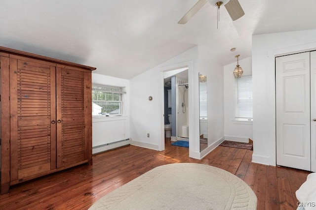 7649 Tuttle Rd, Cicero, NY 13030 - bedroom with a baseboard radiator, vaulted ceiling, hardwood / wood-style flooring, baseboards, and ceiling fan