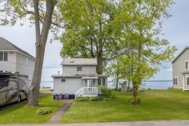 7649 Tuttle Rd, Cicero, NY 13030 - back of property with a lawn and a water view
