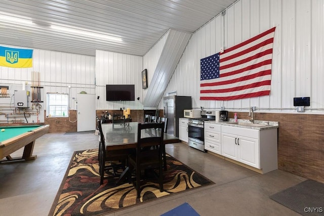 7649 Tuttle Rd, Cicero, NY 13030 - dining room featuring finished concrete flooring, pool table, and gas water heater
