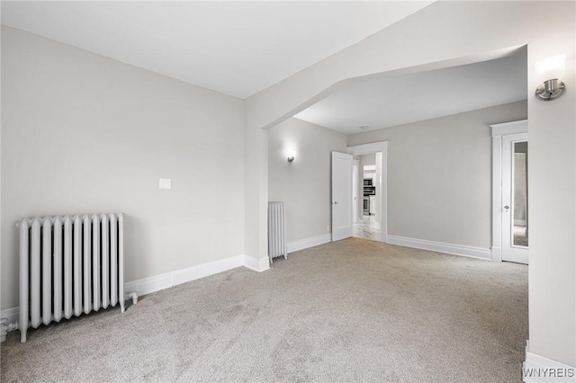 143 Lovering Ave, Buffalo, NY 14216 - carpeted spare room with radiator and baseboards