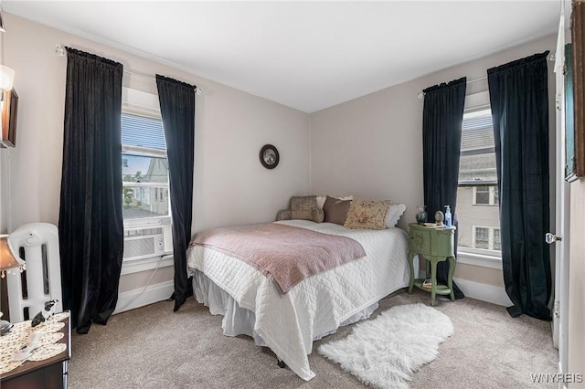 143 Lovering Ave, Buffalo, NY 14216 - carpeted bedroom with multiple windows, cooling unit, and baseboards