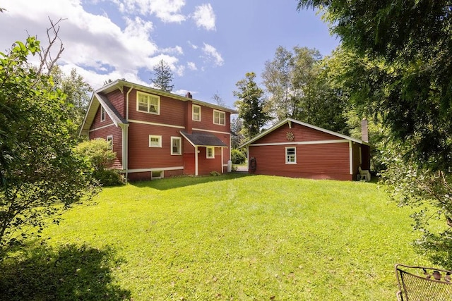 1031 Main St, Middletown, NY 12455 - back of property with a chimney and a yard