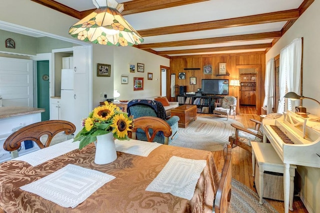 1031 Main St, Middletown, NY 12455 - dining room featuring beam ceiling, wood finished floors, and wood walls