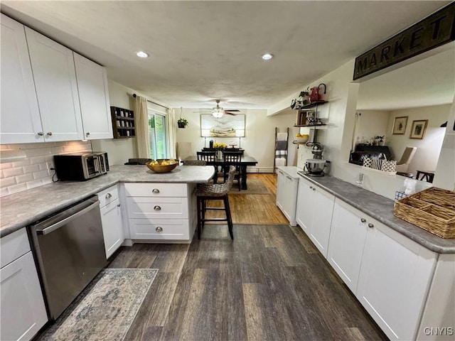 8521 Cazenovia Rd, Pompey, NY 13104 - kitchen with a peninsula, dishwasher, dark wood-style flooring, a ceiling fan, and recessed lighting
