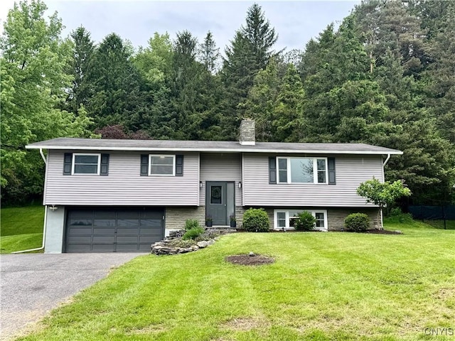 8521 Cazenovia Rd, Pompey, NY 13104 - split foyer home featuring driveway, an attached garage, a chimney, and a front yard