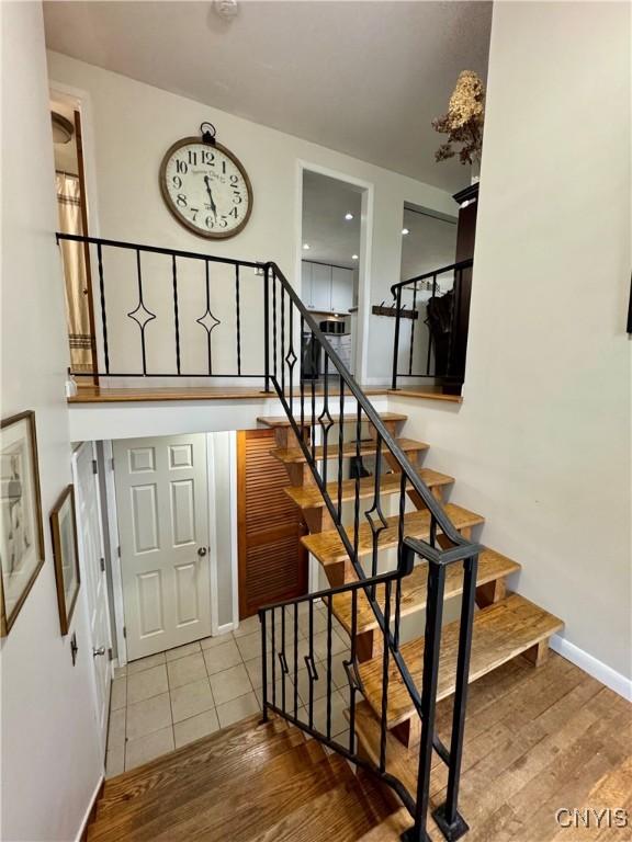 8521 Cazenovia Rd, Pompey, NY 13104 - stairway with wood finished floors and baseboards