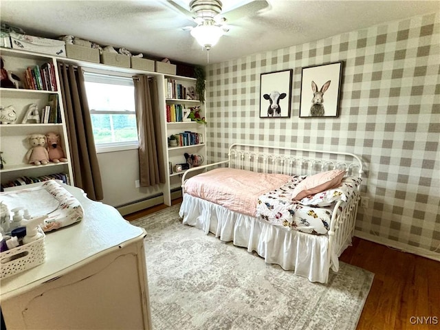 8521 Cazenovia Rd, Pompey, NY 13104 - bedroom featuring wallpapered walls, light wood-type flooring, baseboard heating, a ceiling fan, and a textured ceiling