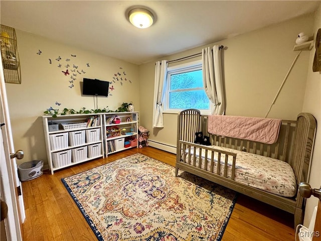 8521 Cazenovia Rd, Pompey, NY 13104 - bedroom with wood finished floors and baseboard heating