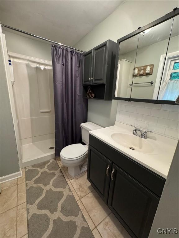 8521 Cazenovia Rd, Pompey, NY 13104 - full bathroom with tile patterned flooring, a shower stall, toilet, and vanity