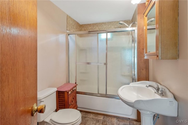 338 Dutch Hill Rd Unit 326, Parish, NY 13167 - bathroom featuring toilet and combined bath / shower with glass door