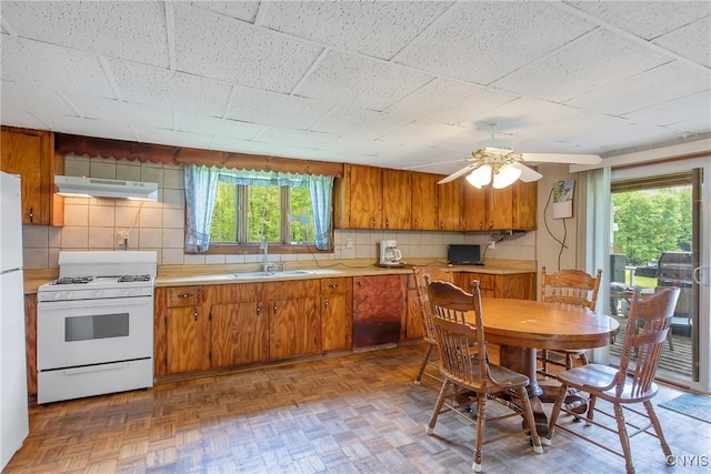 338 Dutch Hill Rd Unit 326, Parish, NY 13167 - kitchen with white appliances, a sink, plenty of natural light, and brown cabinetry