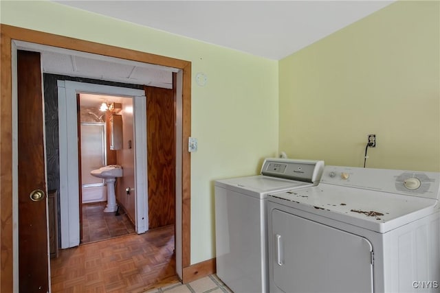 338 Dutch Hill Rd Unit 326, Parish, NY 13167 - laundry room featuring independent washer and dryer and baseboards