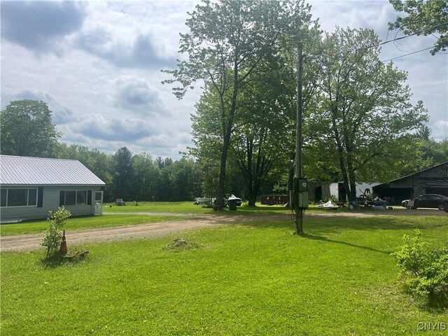 338 Dutch Hill Rd Unit 326, Parish, NY 13167 - view of green lawn with dirt driveway