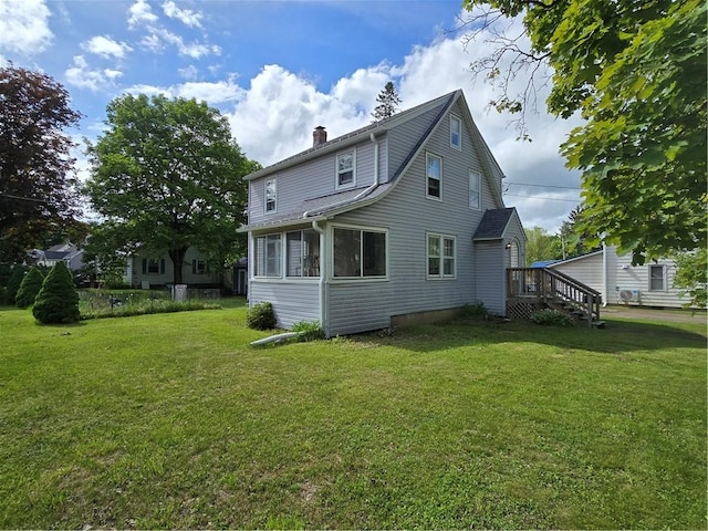 78 W Main St, Sidney, NY 13838 - back of property featuring a chimney and a lawn