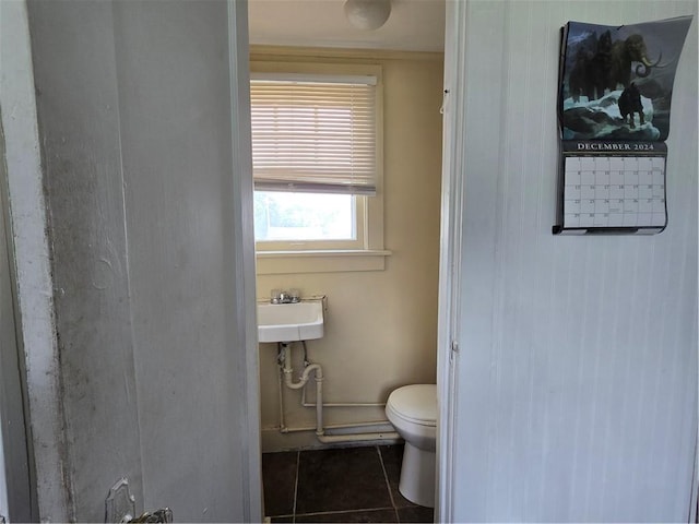 78 W Main St, Sidney, NY 13838 - bathroom with toilet, tile patterned flooring, and a sink