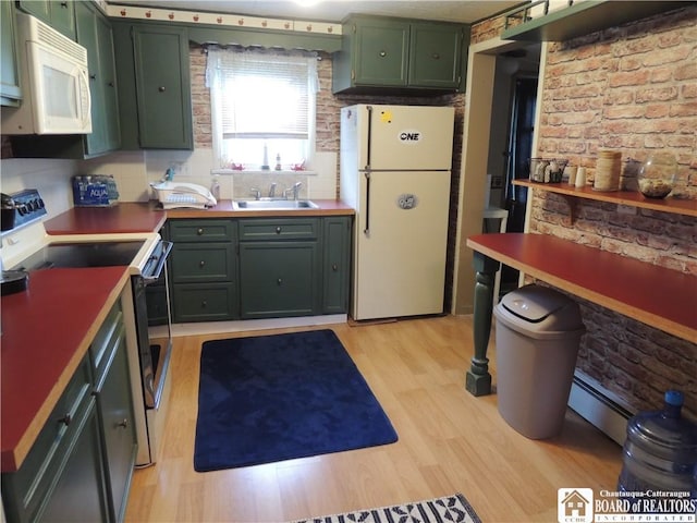 3931 S Ralph Ave, Ellery, NY 14712 - kitchen with white appliances, green cabinetry, light wood-style flooring, a sink, and decorative backsplash