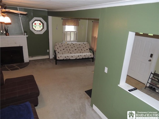 3931 S Ralph Ave, Ellery, NY 14712 - carpeted living area with baseboard heating, a ceiling fan, a brick fireplace, and baseboards