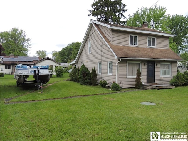 3931 S Ralph Ave, Ellery, NY 14712 - view of front of property featuring a chimney, a front yard, and roof with shingles