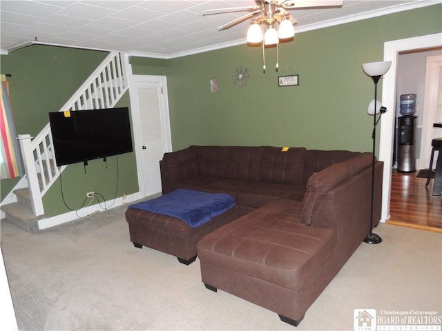3931 S Ralph Ave, Ellery, NY 14712 - living room featuring stairs, crown molding, ceiling fan, and carpet