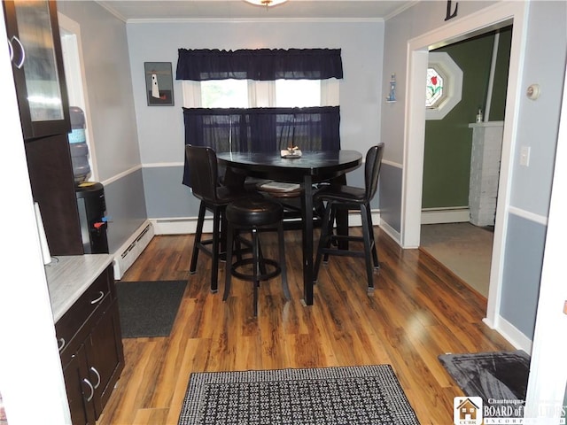 3931 S Ralph Ave, Ellery, NY 14712 - dining space featuring a baseboard radiator, ornamental molding, wood finished floors, and baseboards