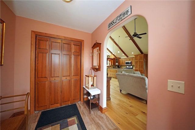9867 State Route 961f Rd, Burns, NY 14807 - foyer entrance featuring light wood finished floors, arched walkways, ceiling fan, and lofted ceiling