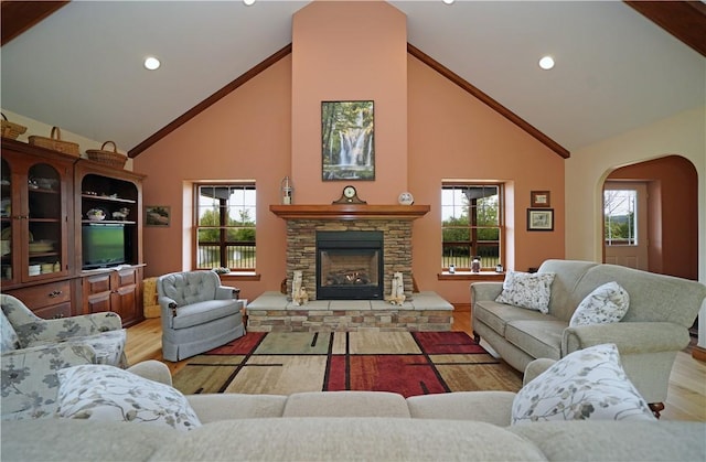 9867 State Route 961f Rd, Burns, NY 14807 - living area with high vaulted ceiling, arched walkways, wood finished floors, a fireplace, and recessed lighting