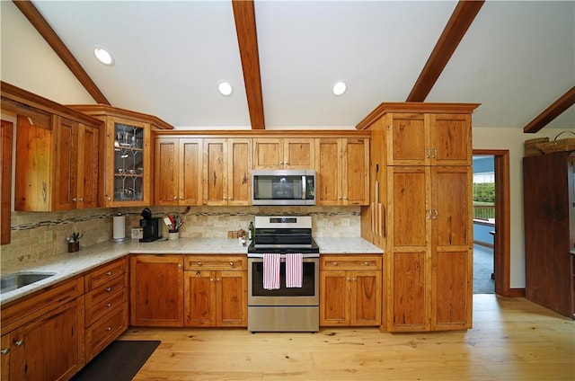 9867 State Route 961f Rd, Burns, NY 14807 - kitchen featuring stainless steel appliances, brown cabinets, backsplash, and recessed lighting