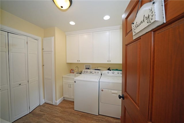 9867 State Route 961f Rd, Burns, NY 14807 - laundry area featuring cabinet space, washing machine and dryer, wood finished floors, and recessed lighting