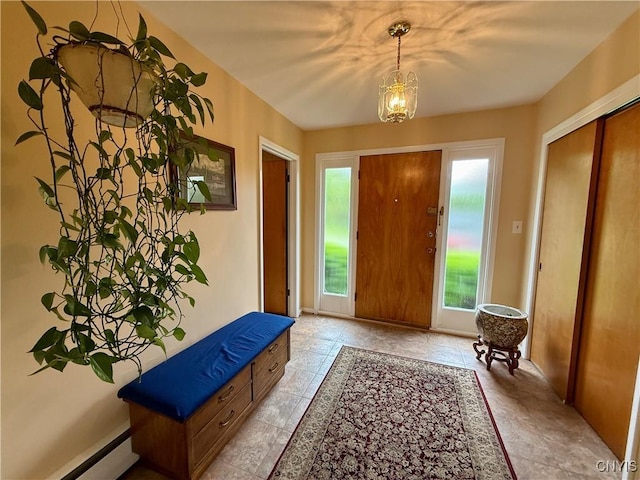 107 Rosewell Mdw, Dewitt, NY 13214 - foyer with a baseboard heating unit and a chandelier