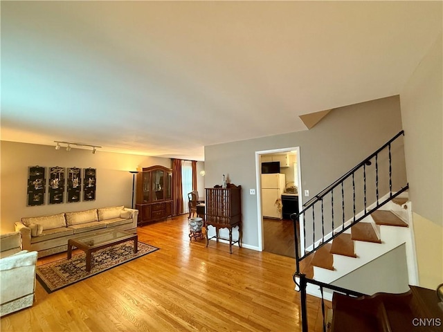 107 Rosewell Mdw, Dewitt, NY 13214 - living room featuring light wood-style floors and stairway