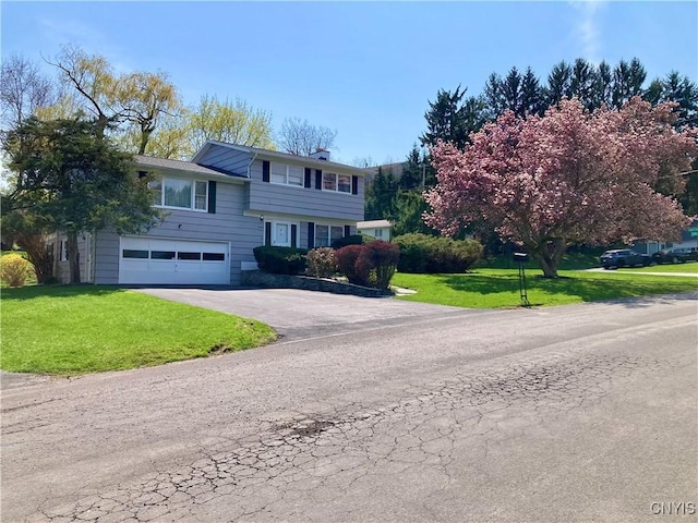 107 Rosewell Mdw, Dewitt, NY 13214 - tri-level home with driveway, a garage, a chimney, and a front lawn