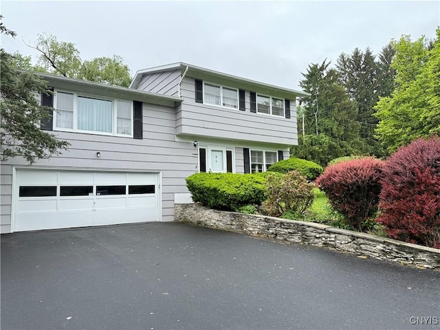 107 Rosewell Mdw, Dewitt, NY 13214 - view of front of home featuring an attached garage and asphalt driveway