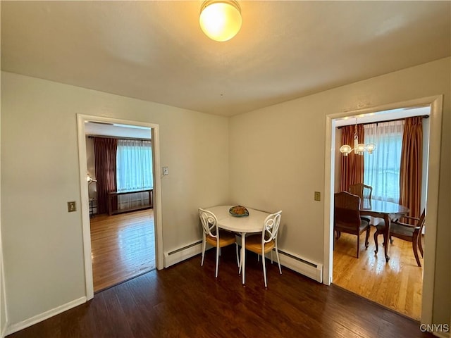 107 Rosewell Mdw, Dewitt, NY 13214 - dining area with dark wood-style floors, a baseboard heating unit, baseboards, and baseboard heating