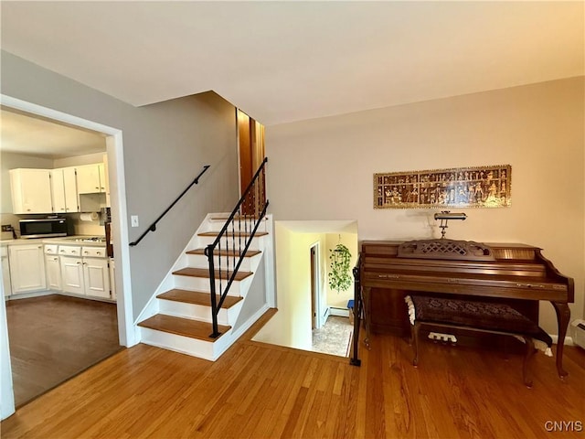 107 Rosewell Mdw, Dewitt, NY 13214 - stairway featuring wood finished floors