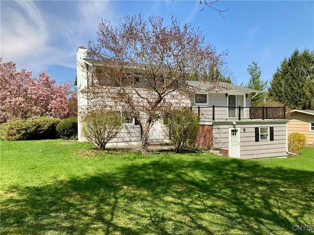 107 Rosewell Mdw, Dewitt, NY 13214 - back of house featuring a chimney, a yard, and a wooden deck