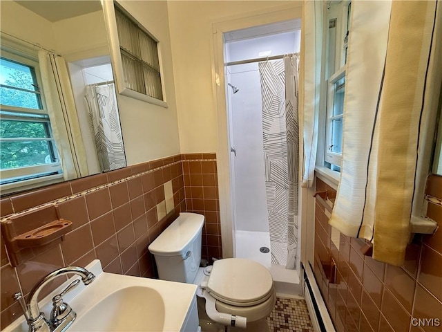 107 Rosewell Mdw, Dewitt, NY 13214 - bathroom with tile walls, a shower stall, toilet, a baseboard radiator, and a wainscoted wall