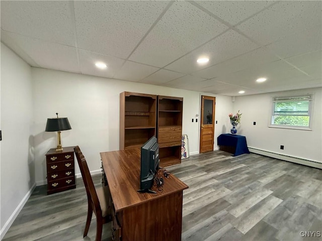 107 Rosewell Mdw, Dewitt, NY 13214 - office area featuring baseboard heating, wood finished floors, baseboards, a drop ceiling, and recessed lighting