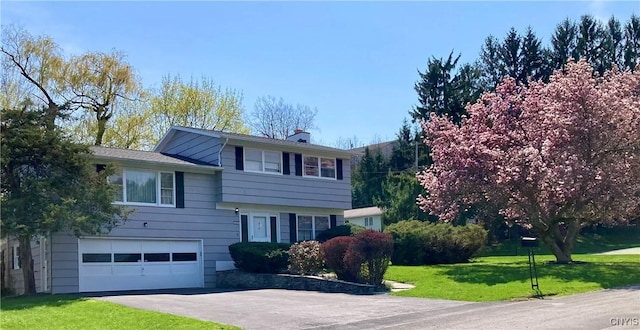 107 Rosewell Mdw, Dewitt, NY 13214 - split level home featuring a garage, a front lawn, asphalt driveway, and a chimney