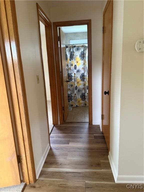 232 Millen Dr, Clay, NY 13212 - hallway featuring light wood finished floors and baseboards