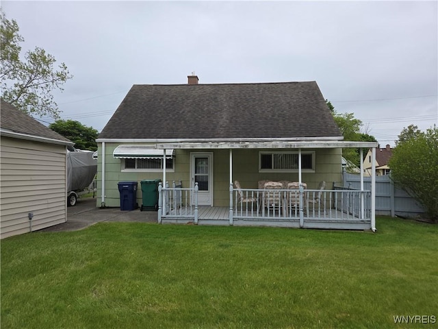 4654 Patricia Dr, Niagara Falls, NY 14305 - rear view of house with a shingled roof and a chimney