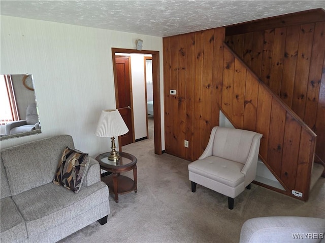 4654 Patricia Dr, Niagara Falls, NY 14305 - living area with light colored carpet, a textured ceiling, and wooden walls
