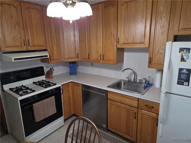 4654 Patricia Dr, Niagara Falls, NY 14305 - kitchen with gas stove, dishwashing machine, freestanding refrigerator, range hood, and a sink