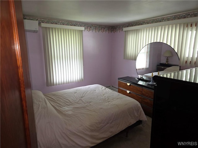 4654 Patricia Dr, Niagara Falls, NY 14305 - carpeted bedroom with multiple windows, baseboard heating, and a wall mounted AC