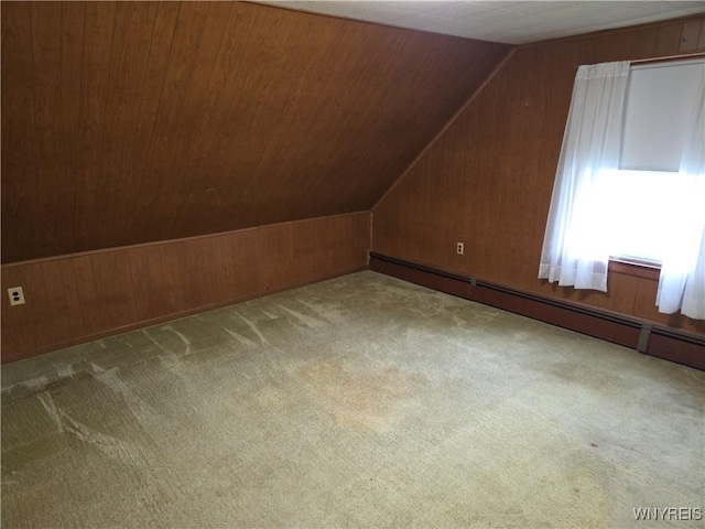 4654 Patricia Dr, Niagara Falls, NY 14305 - bonus room featuring a baseboard radiator, wood walls, vaulted ceiling, and carpet floors