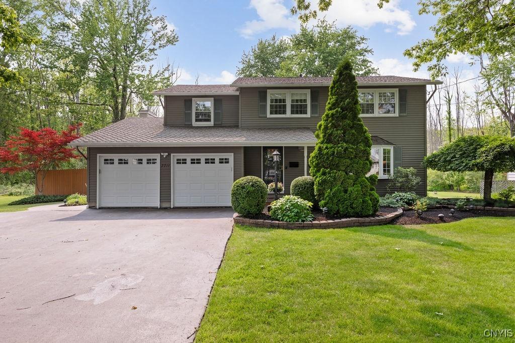 7711 Anchor Dr, Clay, NY 13090 - view of front of property featuring asphalt driveway and a front yard
