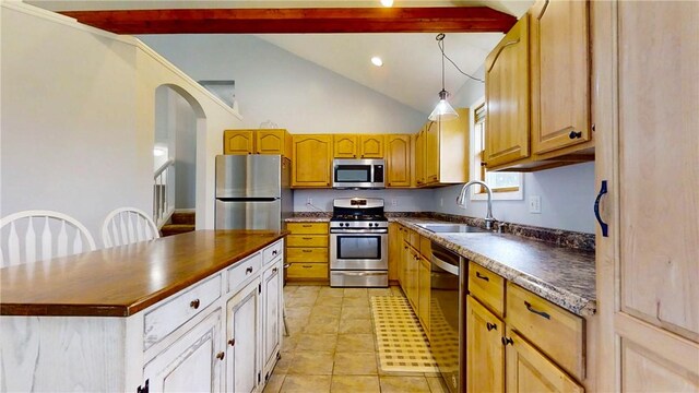 3638 Gorton Rd, Corning, NY 14830 - kitchen featuring stainless steel appliances, a sink, a kitchen island, arched walkways, and decorative light fixtures