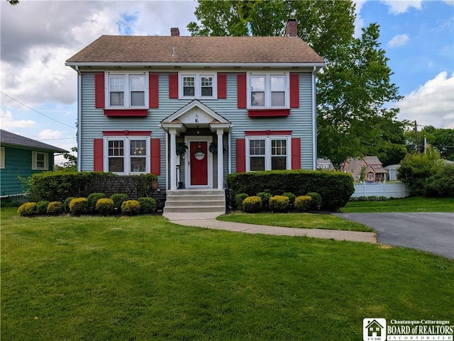 16 Ellis Ave, Jamestown, NY 14701 - colonial house featuring a chimney and a front lawn